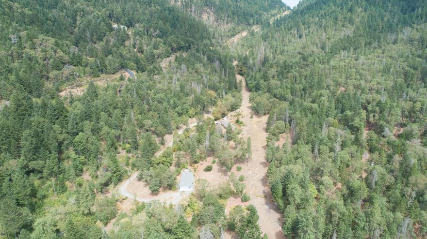 Rural living on 11.92 acres near BLM with potential easy access. (Next door 2855 W. Jones Crk also for sale!) Room for horses or other animals. Short drive to town.  Large newer (2009) clean and ready to move in double wide manufactured home. Split floor plan, 3 Bdrm/2 Ba w/Living room, Family room, Large Dining area & Large Laundry room w/pantry/freezer Mud room area.  Kitchen has a breakfast bar and is open to Dining and Family room.  One side of home has Spacious Master bedroom with walk-in closet.  Master Bath has duo sinks, soaking tub, walk-in shower, linen closet & easy access to Laundry room. Heat pump 2 yrs old.  Koi pond (fish may or may not be included) and small flower garden, fenced.  Shared well with 2855 W Jones Cr.  Water feeds directly into this house from well, which is on this property.  Underground natural gas easement. Seasonal creek on property. Room for RV parking.  No garage but plenty of room to build one as well as an ADU – Buyer to do their own due diligence.