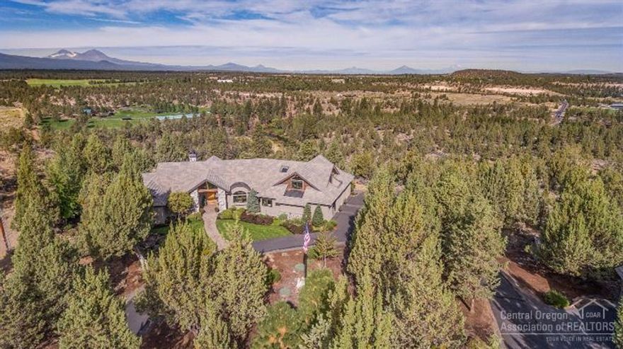 Here is an opportunity to own an extraordinary estate with unobstructed mountain and river views. Gorgeous Norman Building and Design home on a lot like no other! An incredible home with gourmet kitchen, floor to ceiling windows and Norman workmanship. Single level living with master retreat, den and guest suite on the main floor, 2 extra bedrooms and bonus room upstairs. Low maintenance estate with guest suite above an extra detached garage and shop. Minutes to Bend amenities!