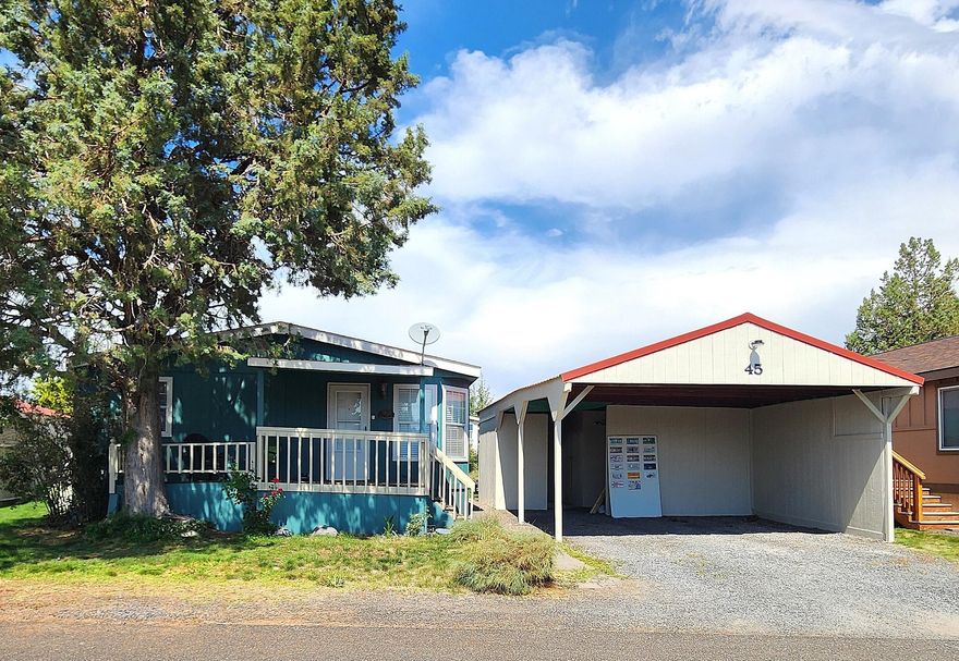 Terrific home in desirable 55+ Mt View Park in Redmond.  Home is in the back half of the park and has Cascade Mountain views!  Enjoy morning coffee on one of your two decks.  Efficient floor plan with vaulted ceilings and good separation of bedrooms.  Large great room with wood stove.  Kitchen with abundant cabinets, tile countertops, brand new refrigerator, and breakfast nook.  Mostly upgraded windows and newer roof.  Large primary suite with walk-in shower, linen closet, and generous vanity space. Washer, dryer, and refrigerator included. Some siding replaced and new exterior paint in July 2025. Space rent is $625/month and includes water, septic, trash, street snow removal and RV parking upon availability.  Come check out this great home!