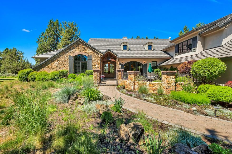 Stunning custom home with Cascade Mountain views on 9.8 acres.  Enjoy the tranquility and peacefulness of this beautiful property offering both privacy and convenience.  An elegant gated courtyard greets you as you enter this Steve Van Sant designed Pacwest built home with exceptional quality throughout.  Single-level living with the exception of a large bonus room on the 2nd floor.  3 Bedrooms / 3 Full Baths + office/den + bonus.  Vaulted Great Room with stone fireplace and mountain views overlooking your own private pond.  Enjoy the beautiful sunsets from the large covered outdoor patio sitting next to a gentle stream.  A private driveway flows into this quiet oasis with 3 acres of irrigation and backing to Tumalo State Park.  Oversized 3-car garage with indoor-outdoor dog kennels and extra storage.