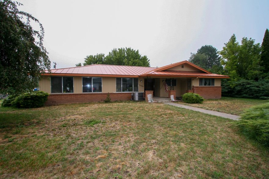 Large rooms and a great layout in this 3 bedroom, 2 bath home.  Large corner lot gives you extra space for an RV or toys.  Large kitchen with pantry.  Extra large bathrooms.  This home feels bigger than its 2180 sq ft.  Furnace is new in 2018.  Metal roof.  Great bones and now you can come in and make it your own.