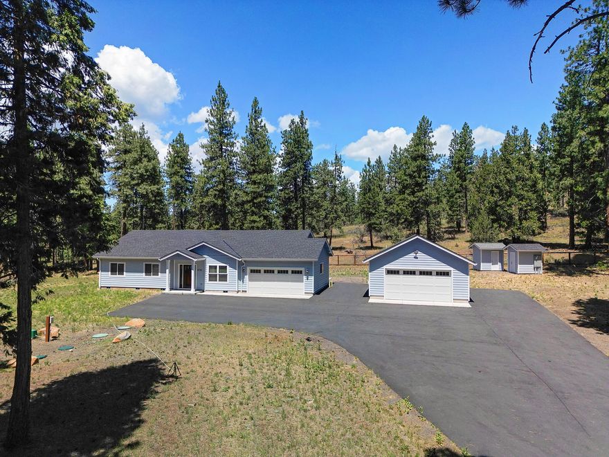 Step into your private oasis 🍃a serene, nearly-new sanctuary nestled on a fully fenced 1.81‑acre parcel, accessible via a locked entry gate. Built in 2018 as a second home, this gem has been lightly enjoyed, offering pristine, like-new condition without compromise.

Surrounded by whispering trees in a tranquil country setting, this property invites you to breathe deeply and reconnect with nature—yet it's just a stone's throw from modern conveniences. Imagine weekend get-togethers around the fire pit, or cozy evenings on the covered porch listening to crickets under starry skies.

A detached shop with power and a full bath adds incredible flexibility—convert it into guest quarters, an artist's studio, hobby workshop, or even a home office. The possibilities flow as freely as the country breeze.

This is more than just a house it's a retreat. It's a place to gather with loved ones or simply settle into the rhythms of nature. If great lives are shaped by quiet moments, this is