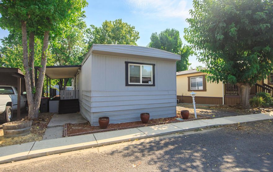 Enjoy the simplicity and comfort of this well-maintained 1973 single wide home, located in the sought-after Royal Mobile Estates an active 55+ community just minutes from downtown Jacksonville. This home features a desirable split floor plan with 888 sq ft. and 2 bed/2 full bathrooms. The spacious living room and dining area feels open and inviting, highlighted by the built-in hutch that provides extra storage and character. The kitchen is equipped with a newer range/oven, and the roof membrane was replaced in 2015. Vinyl plank flooring is in the entryway, kitchen, hallway, and primary bathroom. A washer/dryer less than 2 years old is included. Outside, the back yard has potential for raised garden beds or your own garden retreat. Carport with shed at back. Amenities include a clubhouse with full kitchen, pool table, and a patio space ideal for gatherings. Great value, location, and community surrounded by the natural beauty and charm of Jacksonville!