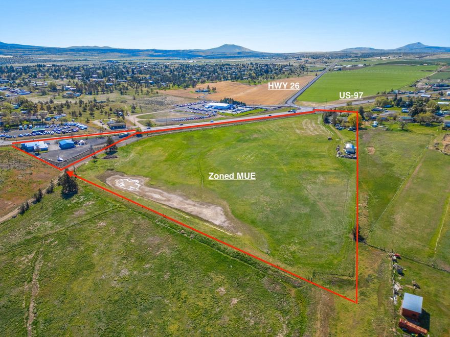 ATTENTION INVESTORS! 17.62 Ac of MUE with amazing location at the corner of Colfax and US 97 and hwy 26 with an average daily vehicle count of over 17,000. Total of 2 parcels (1.19ac & 16.43ac) annexed into the city of Madras and sewer main is near the property line, This property is a huge opportunity. Property use includes Large retail complex or Travel Center, or Hotel or light manufacturing or vehicle dealership or ? Total of 8,770sq.ft. and includes the following: 2,217sq.ft. house, 1248sq.ft. Shop, 3,455sq.ft. Retail Store / Showroom, 1,850sq.ft. 3 bay finished shop. the larger property is currently used as residential and the smaller piece is used as MUE Commercial. All property can be used as MUE. Call your agent for the backup package and showing. Seller will also sell the parcels separately.