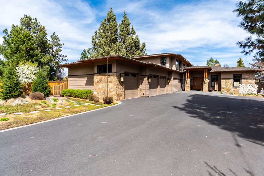 A true riverfront masterpiece! This exquisite home is located between Downtown and the Old Mill District in the heart of Bend Oregon where you can walk or paddle to dining and shopping! Throughout the home there is a general River, Circle, Wood theme with a focus on nature and the use of natural materials, each carefully hand selected by the owner. The great room features a 16 foot bank of folding doors for inside/ outside living as well as vaulted ceilings and a large fireplace. The kitchen is a master chef or entertainers dream and features a 250 million year old slab countertop as the center island as well as a butlers pantry. Two guest bedrooms, two baths, office, and the master bedroom are located on the first floor, with 2 additional beds/baths and a bonus room with covered patio on the second level. The outdoor decks and patios include two docks and are like no other in Bend, where you can hear the soothing sounds of the Deschutes river. Also includes a short term rental permit.