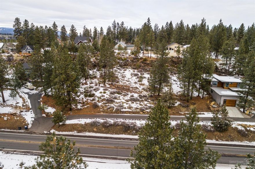Investment opportunity- Buildable .77 acre lot nestled between evergreens in SW Bend. Located in the city limits. Water Sewer and Power are nearby. Per City of Bend- lot may be subdivided, several possibilities. Buyer to do due-diligence to confirm. Great homes nearby.