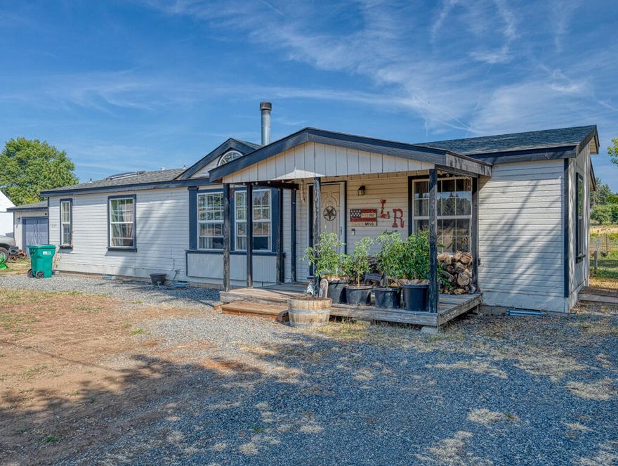 Welcome to your new home! This beautiful 3 bedroom 2 bathroom manufactured home is situated on horse property and is perfect for those who love the outdoors. The home features a cozy living room with plenty of natural light, a large kitchen, a dining area perfect for entertaining guests, and a large bonus room that would make a great game room. The primary bedroom has an en-suite bathroom with a large soaking tub and separate shower. The outside features plenty of room for your animals, extra parking, and an additional 2.28 acre lot with road access and 6 water spigots each with electric. Schedule your showing today.