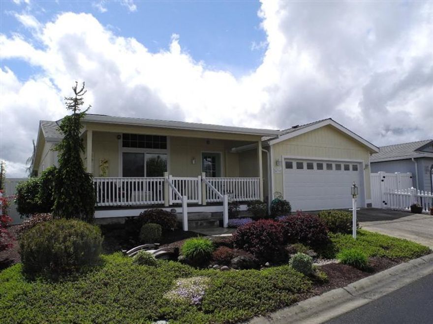 Charming Craftsman style manufactured home in Miller Estates a wonderful 55 + manufactured home community. Covered front porch, vaulted ceiling, great open floor plan, ceiling fans, handsome flooring, large fenced yard with a covered patio. Lovely landscaping, finished garage.