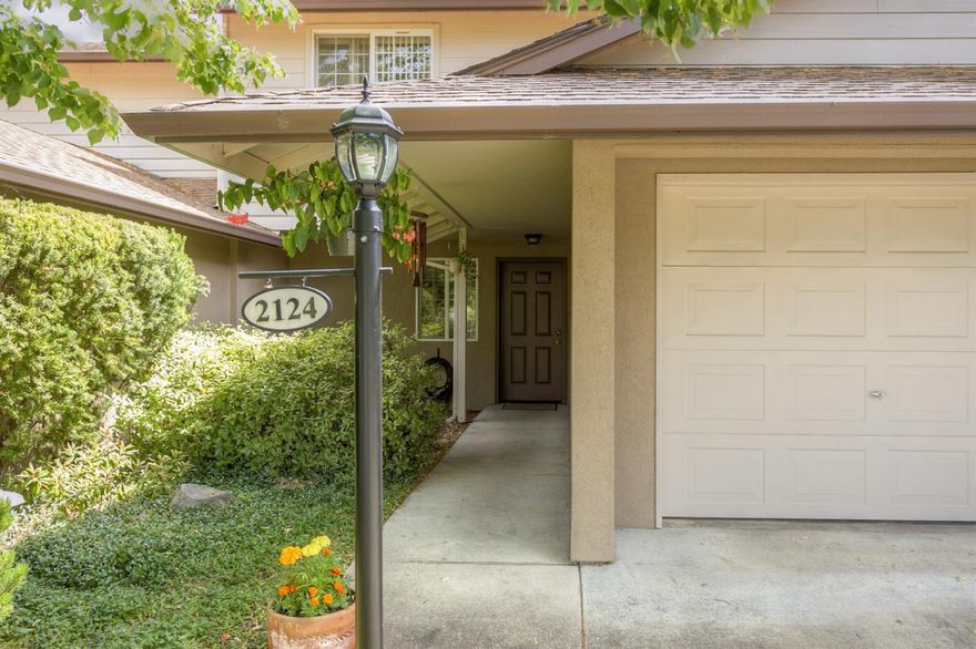 Wonderful townhome in popular Ashland neighborhood. This light and bright home has a vaulted living room ceiling and beautiful eucalyptus floors throughout most rooms and closets. Durable tile is located in the entry, half bath and kitchen. The two bedrooms/two full bathrooms are en suite. There is a large laundry/utility room with built-in cabinets conveniently located off the single car garage. From the dining room there is a sliding glass door to the patio and the charming back yard, a special feature of this lovely property. This little garden paradise has room for your vegetables and flowers. The home has been lovingly maintained and is in move-in condition. The neighborhood is virtually flat and it is located near shopping. You'll love it!