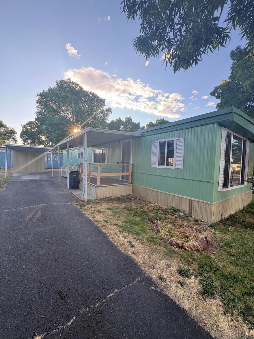 Cozy 2 bed, 1 bath 1973 manufactured home in the desirable Rogue Valley Meadows 55+ community. Features fresh interior paint and a recently updated roof for added peace of mind. Perfect for those looking to personalize and make it their own. Home is being sold as-is. Includes a storage shed and access to a well-appointed clubhouse with full kitchen, restrooms, showers, cable TV, exercise area, library, billiards, ping pong, foosball, and a new card table. 24-hour laundry facility onsite. Park also offers a recycling area for cardboard, extra trash, and yard debris (available upon request). No HOA fees! A fantastic opportunity to build equity in a welcoming, amenity-rich community.