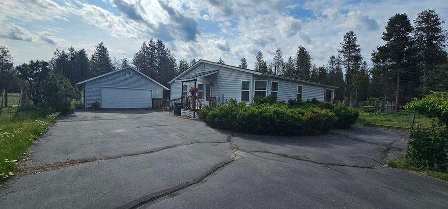 Discover your dream home nestled on a serene .99 acre lot, with mature nature right at your doorstep! This charming 4-bedroom 2057 sqft 2 bath house offers ample living space, perfect for both relaxation and entertaining. The oversized garage is a haven for car enthusiasts, hobbyists, or anyone in need of extra storage. With the national forest just a stone's throw away, you'll have endless opportunities for hiking, biking and exploring the great outdoors.