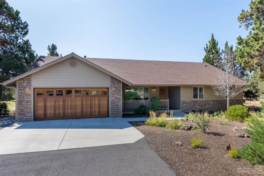Single level home on 2.5 acres with privacy and backs to seasonal COI canal. Great outdoor living with patio, lawn, garden, residential backyard basketball court and front porch with trex decking. Irrigation with COI. House interior updated with granite tiled counters in the kitchen, slate floors, stainless steel appliances, carpet, clear cedar garage door, 2015 new hot water heater and 2019 new furnace. Vaulted ceilings, wainscotting, master suite, smart panel, security system, surround sound and AC. 3 bedrooms plus bonus room and 2 bathrooms. Many possibilities for the land and adding square footage to the house.