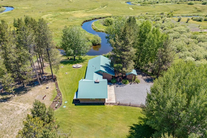 Discover your dream get away with this stunning river front property featuring breathtaking Paulina Peak views as well. This spacious two-bedroom, one-bath cabin offers all the amenities you need. Enjoy riverfront views from the expansive outdoor deck and cozy evenings by the
firepit. The expansive green yard is perfect for outdoor activities, while two spacious detached garages provide ample storage, recreational or workshop possibilities. The gated drive and gravel
driveways ensure privacy and convenience. Peace of mind with a newer septic system and high-quality water filtration system. Second lot previously had septic installed and could potentially be developable. With extensive natural space and river frontage, this property is a rare find. Don't miss the chance to own this incredible cabin retreat. Most furnishings inside the cabin are available for $1000.00.