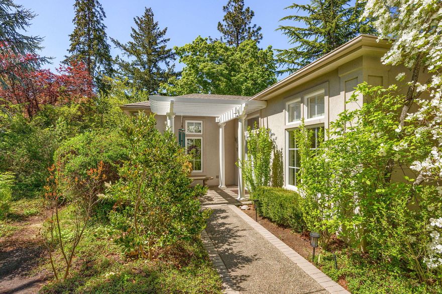 Beautifully appointed home located just 4-blocks from downtown, perched above the library with mountain views. Expansive interior features soaring 10-foot ceilings, abundant natural light, and a bright, open layout. The main level offers dual primary suites with walk-in closets, spa-inspired baths, and a cozy double-sided fireplace. French doors lead to a generous veranda—ideal for outdoor dining and relaxing. Elegant wood and slate flooring throughout. The lower level includes a private third bedroom with its own entrance and bath, a large bonus space for a media, art or workout room, plus ample storage, and a 3-car garage with RV bay. Low-maintenance yard with mature landscaping, roses, and automatic sprinklers. Also included in ''AS IS'' condition is a charming 900 sq. ft. 2BD/1BA cottage. Guest house/cottage square footage is not included in the 3220 sq. ft. of the main house.