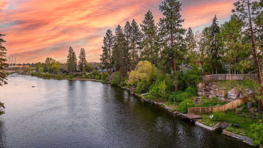 An exceptional opportunity to own and develop a legacy lot with an unparalleled riverfront setting that will endure for generations to come. Elevated, with full river views both upriver toward the whitewater park, and downriver past the iconic Columbia street bridge, this setting is somehow both private and dynamic. Old growth pines and gentle topography allow for a myriad of home designs, and toward the river, a natural rock outcropping gives way to charming stone steps down to an earthen landing that is primed for river adventures. This property converges the very best of Bend, from recreation to libation to celebration, and so much more.