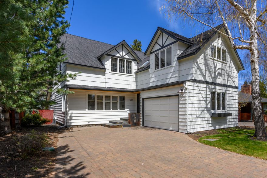 Iconic Drake Road Classic.  A rarely available and highly desired westside location with easy access to Mirror Pond from the footbridge to Drake Park and all the activities, shops and restaurants in the heart of downtown Bend. Timeless architecture with a sense of history from its 1925 roots and complemented by an updated interior that offers relaxed, contemporary comfort. Main gathering room with fireplace adjacent to dining room. Oak plank floors on the main level and terracotta brick tile flooring in the two flex rooms. The  cook's kitchen has upgraded stainless appliances, a large island  prep area with granite countertop & breakfast bar, bistro style dish shelving, built-in cabinetry for extra storage and a gas fireplace that keeps the space warm and cozy.  Large ensuite  primary bedroom and two guest bedrooms upstairs. Plus a fenced backyard setting with paver stone patio & pathways and mature landscaping.