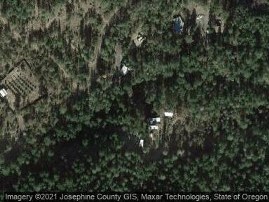 Cute one bedroom cottage on useable 6+ acres.  Sold Only