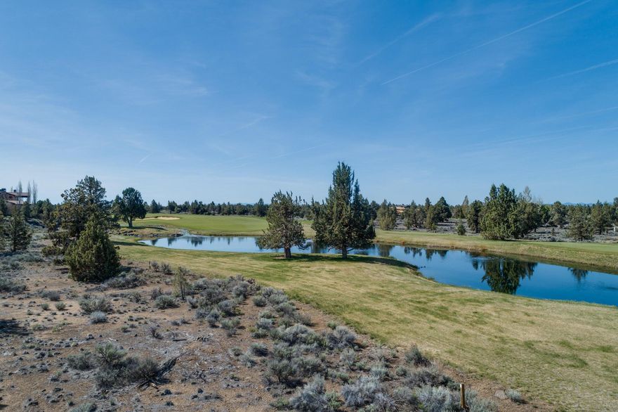 With huge views of the Cascades and the impressive Fazio #6 Fairway. Enjoy quiet solitude at the Lake's edge and up the wandering creek, from this stunning location in The Estates. A beautiful easy build site. Enjoy all of the amenities of the vibrant Juniper Preserve Resort and Pronghorn Championship Golf Courses, Restaurant, 24 hour manned security gate, Members Club, The Huntington Lodge Hotel, Day Spa, Multiple Pools, Fitness Center & Tennis, Trails, Dog Park. Price includes Full Pronghorn Club Membership - $115,000.