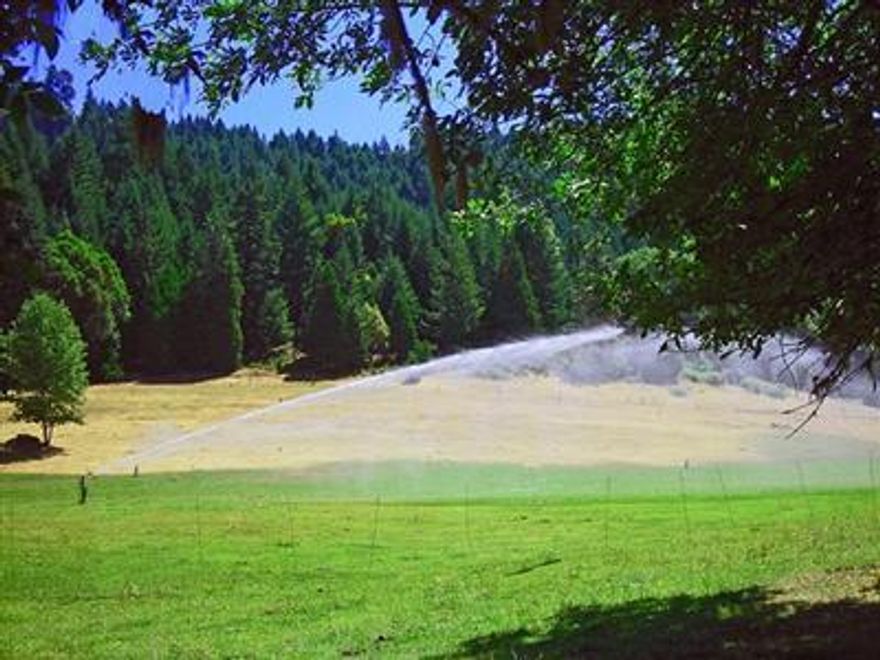 Mountain Shadows Ranch! 180.93 tranquil acres, 42 miles North of Medford, 16 miles from the world famous Rogue River w/existing home & 2nd approved home site. 2850 ft elev. 1.1 million net board ft of marketable timber, including yr around creek & large pond w/water rights. Water rights for 50+ acres of irrigated hayfield & pasture. Gravity flow spring produces abundant domestic water. Hydro electric license approval pending. 8 inch hydro penstock is in place. Fruit/ nut trees, organic garden w/partially complete masonry green house/ root cellars create the potential for self-sufficient off grid living. Sellers are highly motivated to sell.
