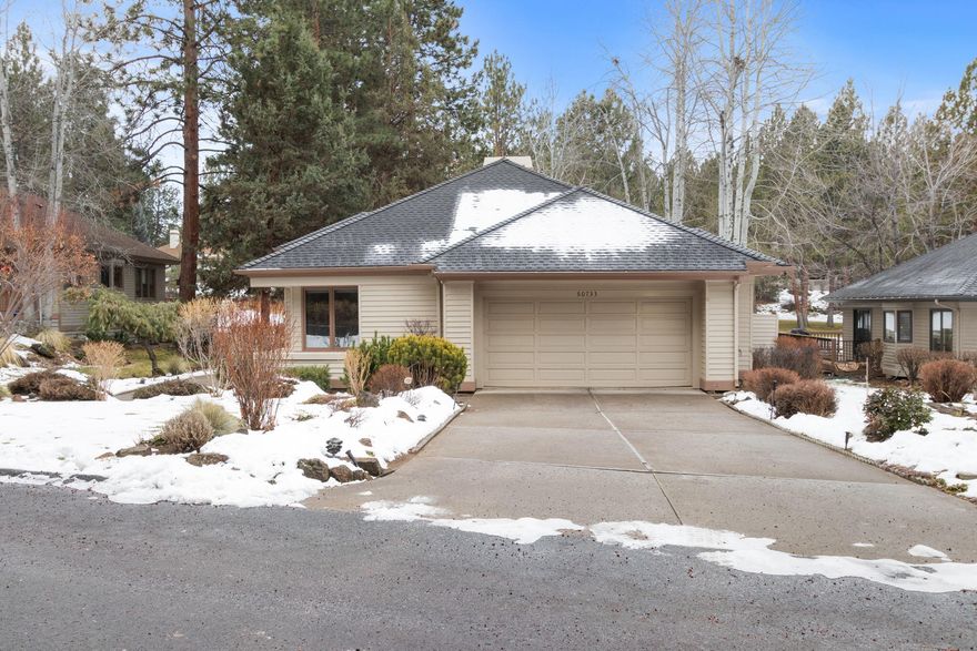 Tastefully updated and well-maintained single level home located on a .19-acre lot in the Aspen Village section of the desirable gated community at Mountain High. Backing to the 4th hole of the golf course and set among the trees offers a park like peaceful setting and privacy. The kitchen, dining room and breakfast nook all open to the great room with spectacular wood framed windows and doors that allow plenty of natural light and views of the fairway. The modern designed kitchen features sleek cabinets, stainless appliances, including a gas Jenn Air range. The floor to ceiling painted brick surround gas fireplace creates quite the statement and ambiance on its own. In addition to the new kitchen, beautiful wood flooring throughout the living and kitchen space, the furnace and water heater have also been replaced. The primary suite offers separation from the 2nd bedroom and den. Neighborhood amenities include tennis/pickle ball courts, swimming pool, a beautiful pond and common spaces