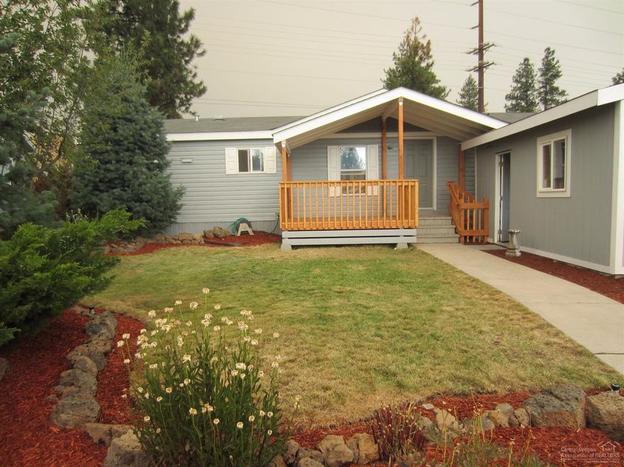 WOW! This home has been rehabbed from top to bottom. All brand new: int/ext paint, high quality carpet/pad & laminate floors, faucets, light fixtures, appliances including fridge w/H20&ice, ceiling fans, toilets, blinds. Mstr has walk in shower & soaker tub. Big .22 acre fenced lot w/storage building and double car garage. New sprinkler system. Great location. Golfside is a wonderfully maintained newer mobile park.The land is leased at 411.46/month.