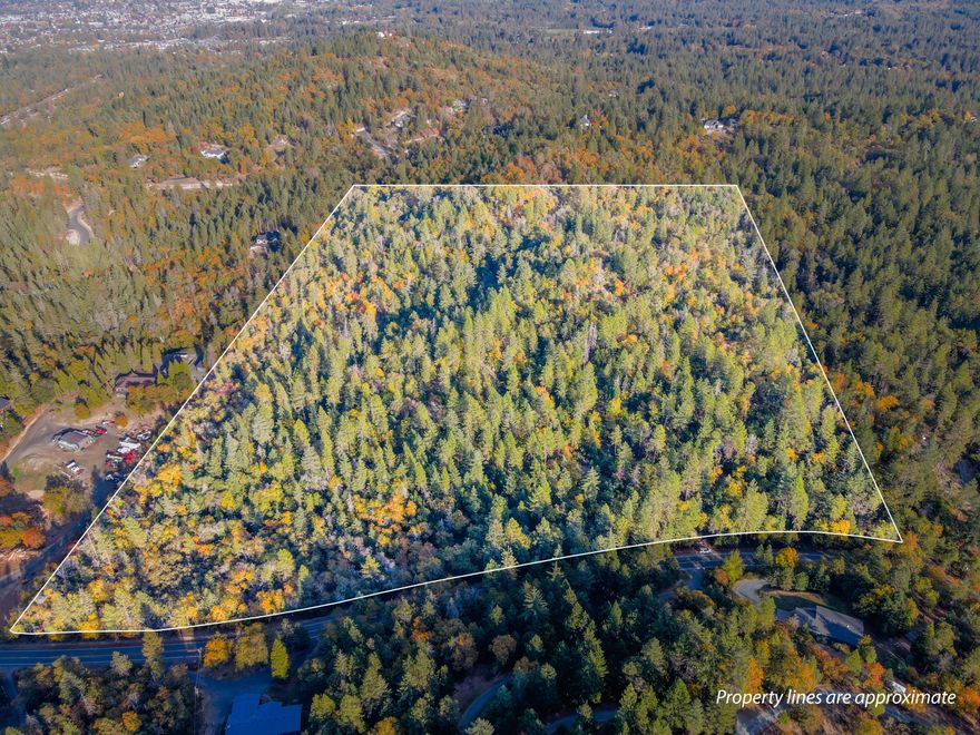 Once-in-a-generation development property that has been in the family for decades! 48.25 acres of RR5 zoned property in the desirable Midway Ave area that is less than 10 minutes from town! The Terrain here is diverse with some Gradually Sloping areas and some sloped areas with dramatic views. Enjoy a pretty mix of conifer and deciduous trees. This property is a developer's dream and looks capable of producing 9 beautiful lots! This is an extremely rare find in an excellent area, and could be one of the last premiere development parcels of its kind. Envision a fantastic and quality Subdivision in this location. Buyer to do their own due diligence concerning the development potential of this property. Call for your tour today!