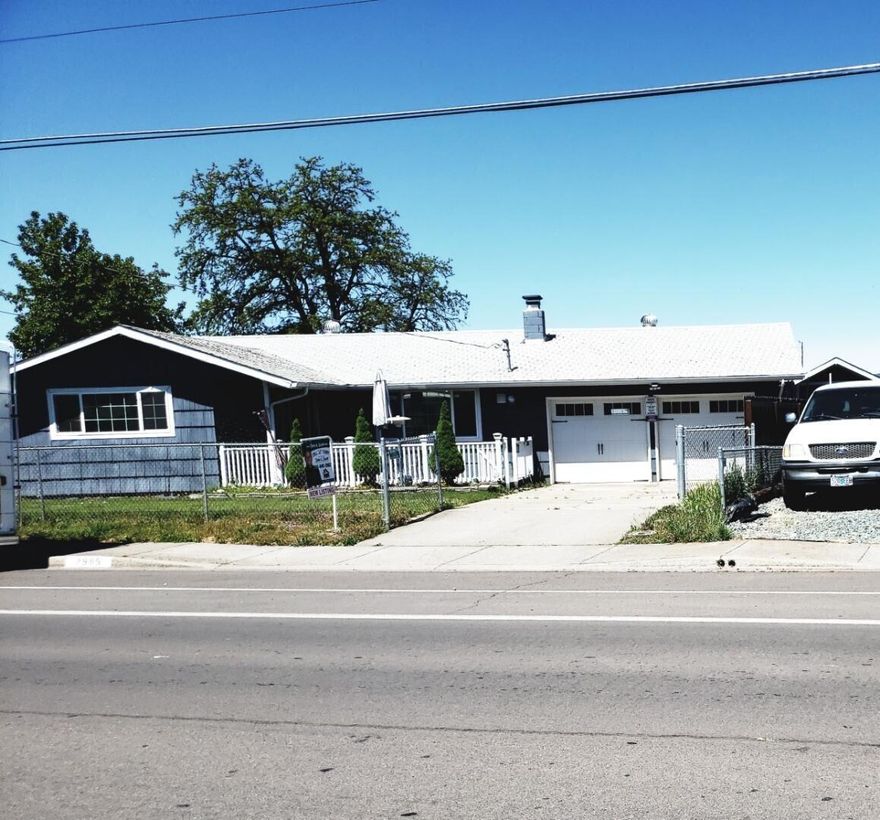 Here's a spectacular opportunity for your 1st-time home buyers or investors. This wonderful 3-bed/1-bath home is conveniently located just down the street to a large city park. Also, it's extremely close to schools, shopping, restaurants, Eagle Point, and more. It has a beautiful large backyard with a storage shed and the back yard is fully fenced. On the left side of the home there's RV parking. The seller has updated many items including newer vinyl windows throughout, newer sliding glass door newer garage doors w/garage door opener, newer front door (being installed May 16), solid-core interior doors, newer heating/ac, +more. It also has real hardwood flooring, wood burning fireplace, stainless steel oven plus refrigerator is included. There is a large covered back patio. The front yard is also completely fenced with gate and there's a wood deck to enjoy relaxing on. All this plus a 2-car garage attached. This home will qualify USDA, FHA, or VA. Bring your clients, they will love it