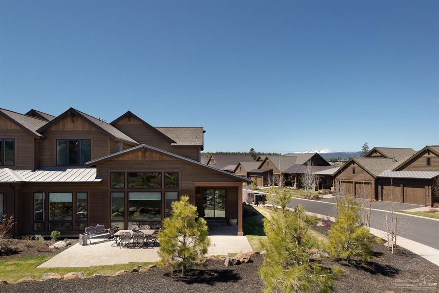 This beautiful Parkside Tripleknot town home welcomes you with a spectacular setting in the sought after Tetherow Golf community. This gorgeous home features an incredible great room and gourmet kitchen with spa like master suite and office on the main floor. 2 Jr suites upstairs, 1 with Cascade mountain views. One of the best and largest corner lots in the neighborhood. Tons of natural light. Maintenance free living close to all the great amenities Bend and Mt Bachelor offer.