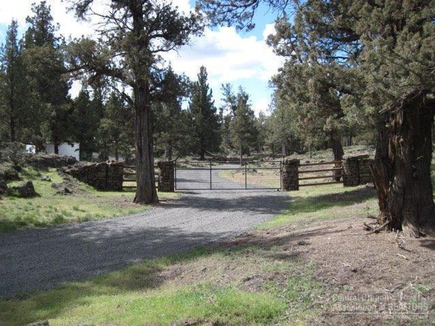 Absolutely beautiful 10.51 acres of meticulously manicured acreage. All trees are trimmed and every rock has been picked up! Property is already subdivided into two lots. Lower lot has all utilities septic, well, electric. Includes Shop with specially lumbered board & bat siding, underground sprinklers, landscaping, awesome fencing including gates, decorative rock pillars. There are very few properties that can hold a candle to this one! Property is ready to built on now and only 3 blocks from paved road.