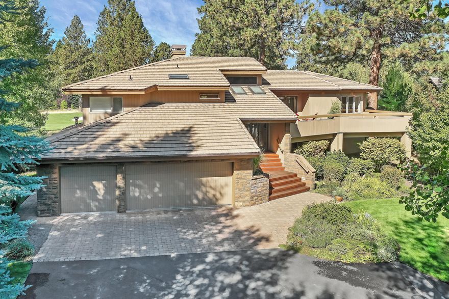 Beautiful custom built  4 bd, 3.5 bath, 3,315sf on .44 acre Sun Forest home overlooking the 16th tee box of the Broken Top golf course. Split entry with spacious great room, gourmet kitchen, dining area, powder bath and luxurious master suite with new carpet, a spa like bathroom,  2 walk in closets, and 2 fireplaces on the upper level. Step outside onto one of the multiple decks and enjoy the private hot tub area and lovely views all around. Downstairs offers high end engineered flooring throughout, 3 additional bedrooms, a generous family room with fireplace, laundry room, and full bathroom & 3 car garage, (3rd bay is currently a music room) +dumb waiter. This home easily lends itself to indoor outdoor entertaining. The abundant natural light creates a very relaxing ambiance.. Upgrades include new high efficiency HVAC with dual zones, kitchen backsplash, refinished decks, and window coverings downstairs, California Closet systems, and more. This is the home you have been waiting for!