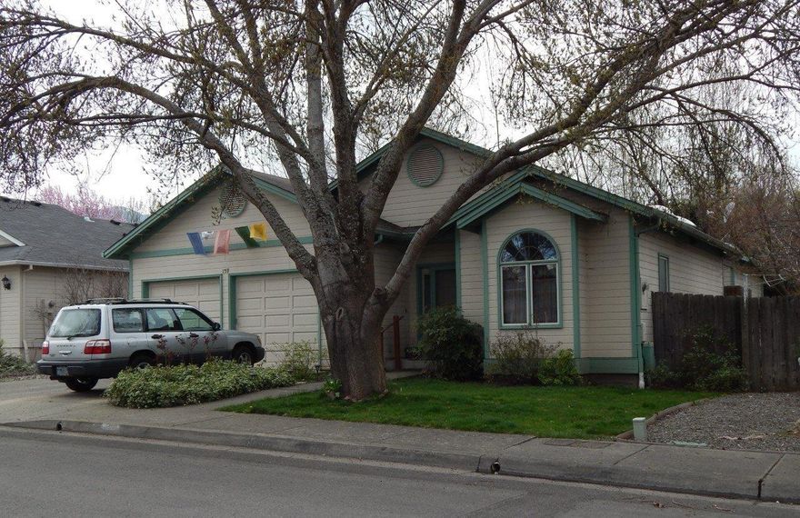 Why pay rent? Here's a 3/2 home set on a tree-lined street in a convenient location near schools, the farmer's market and town. Three skylights illuminate the bathrooms and the third bedroom. Oak floors grace the kitchen, dining room and third bedroom too. The compact kitchen has plenty of storage with a tall pantry in addition to the cabinets. A cozy dining area off the kitchen has big windows to enjoy the side yard views. The master bedroom enjoys a back of the house location. The master bath features a double vanity and large walk-in closet. Doors in the dining area and the master lead to a deck in the private, fenced back yard. Bamboo floors were installed in two bedrooms in 2011. The heat pump was replaced in 2013, the water heater in 2016 and the roof is new! Here's your opportunity for a well-priced home in Ashland.