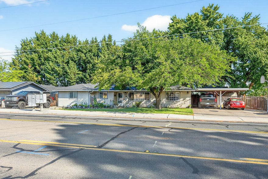 Versatile 4-bedroom SW Medford property! Utilize bonus room as 5th bedroom, family room or flex space. Larger than average city property of .28 level acres. Parking for 4+ vehicles at main driveway. Second driveway w/double gate to addtl. parking & RV power hook up. Inviting interior w/gas fireplace in living room. Updated kitchen w/newer stainless steel appliances. Dedicated laundry room w/utility sink. Sizable bonus room w/exterior access. New 95% efficient gas furnace & AC unit installed Dec 2021. Upgraded plumbing- all new PEX pipe interior water lines, fittings, supplies, and shut-offs installed Jun 2025! Invoices attached. Backyard offers both plentiful sunshine & generous shade from the mature trees. No activity left behind- you'll have full use of 3 large sheds for hobbies, large patio w/gazebo for entertaining, hot tub, thriving garden, catio, established chicken coop & room for more! Located in a residential neighborhood near schools, parks, and shopping. Call to view!