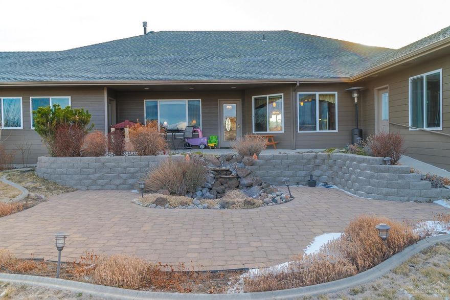 This unique home offers expansive Cascade mountain views and immaculate landscaping. 6 total bedrooms, 4 Master Suites, 2nd largest suite is off the kitchen & has private entrance. Dual furnaces & water heaters. Extra deep three car garage, formal dining, open kitchen to family room & formal living too. Over 2 acres w/space for RV garage & shop. Enjoy fine living in beautiful Madras!