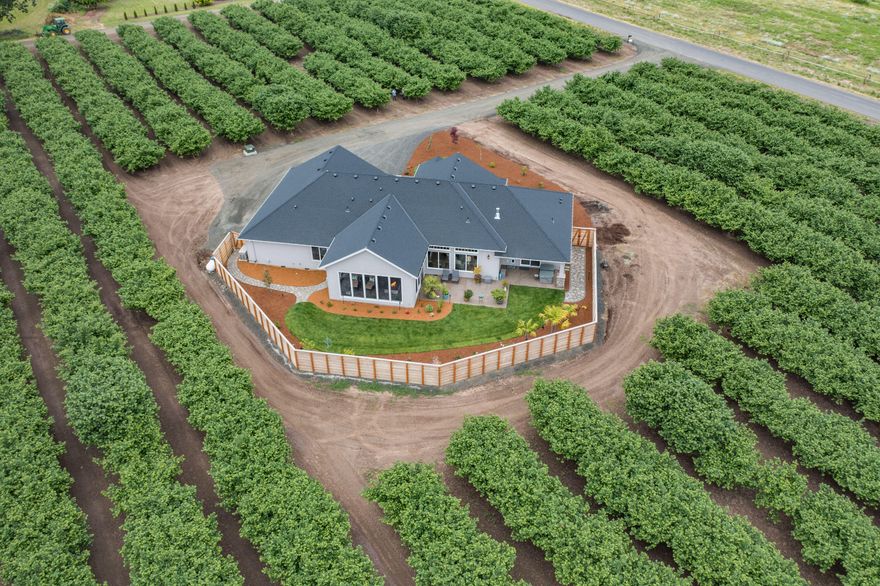 Luxury living in the heart of Willamette Valley! This custom modern farmhouse is tucked inside almost 38 acres of a highly profitable hazelnut orchard! Gourmet kitchen with amazing cabinetry, granite & upgraded appliances package! Relax inside the massive covered and screened outdoor living area while you warm yourself around the ringed fire pit. The 10 yr old Yamhill variety hazelnuts are known to be some of the most prolific blight-resistant varieties and their production is almost at a sustained peak!