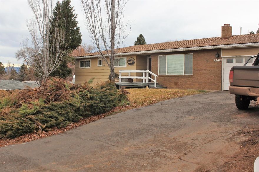 Beautifully updated 3 possible 4 bedroom home with 2 full bathrooms.Home has been freshly painted on the interior and has beautiful laminate flooring in all rooms except bathrooms and Master Bedroom.Custom molding and beadboard throughout adds charm to this beautiful home.The kitchen has plenty of counter space and storage with semi-custom soft close cabinets and stainless appliances.Bathrooms have been updated with new tile and cabinets.Home has a 2014 Gas F/A furnace with A/C, a wood burning fireplace in the living room,and a gas fireplace/stove in the Master Bedroom. Master has custom built closets and headboard along with a bonus room that could be used as a separate bedroom, office or nursery. Master also has doors leading out to the deck. Double car garage has an automatic garage door opener, and a separate spacious workshop area.