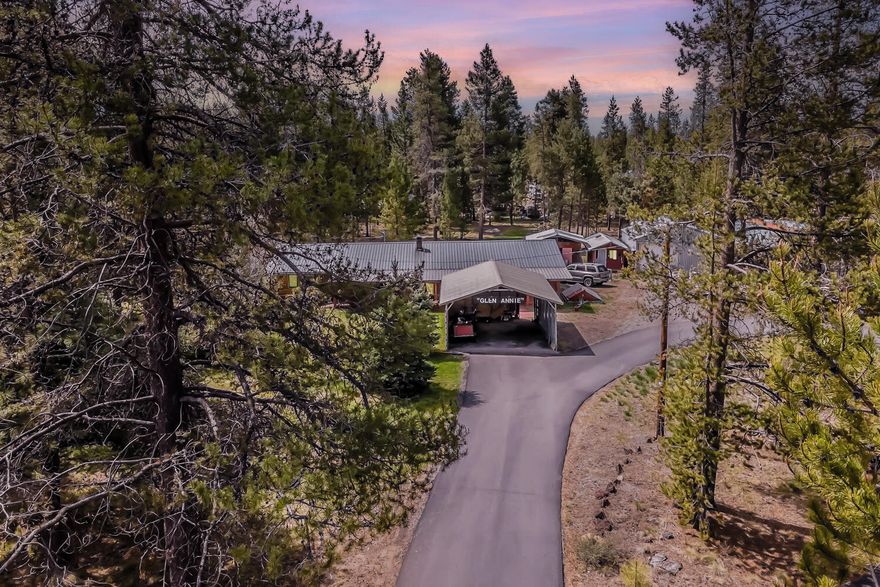 When you think of Central Oregon, do you think of a log cabin in the trees? Now one is available for you to purchase! This comfortable and lovingly cared for log home offers 3 heat sources, 2 water heaters, large common rooms, flexible spaces for office, homeschooling or hobbies and a shop on 1.28 acres! The property has mature trees and a nice lawn. The Primary suite features a quaint window seat to sit and dream about your next adventure. The second bedroom has brand new carpet. An enclosed sunroom with laundry room runs along the rear of the home. Covered decks in the front and back. One shed is used as a bunk house and comes furnished. The other is a woodshed. Room for all your vehicles and adventure gear! Located on a dead end not far from a paved road. Circular driveway is paved with a carport. Shop has a newer door and interior loft for extra storage. Several 0% Down Payment options exist for this home. Schedule a showing today with your Realtor!