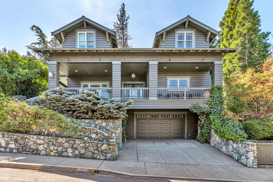 Fantastic, luxury living in the heart of downtown Ashland! This craftsman style 4 bed, 3.5 bath boasts the perfect blend of elegance & comfort plus lovely views of the city lights & surrounding mountains. Beautiful details throughout including hardwood floors, soaring ceilings, wood wrapped windows, antique inspired push button light switches, French doors w/glass paneling & a striking entry way staircase w/intricate railings & banisters. Gourmet kitchen, open to the living area w/a large center island, built-in banquette seating & glass front cabinetry. 2 expansive primary suites w/sitting areas, walk-in closets & ensuites featuring dual sink vanities, tile showers & private water closets. Convenient, all-level elevator, formal dining room, plus a dedicated laundry room w/built-in cabinetry & granite counter. Spacious covered patios surrounding by lush landscaping & charming rock walls are the perfect place to entertain! Oversized 2-car garage & dedicated basement storage room.