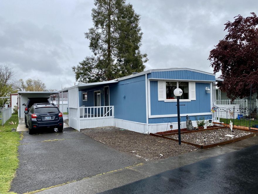 Beautiful, bright & well- maintained manufactured home in Rogue Valley Meadows 55+ mobile home park. New flooring, fresh pain and updates have brought this home back to life. This charming 896 sq ft home features 2 large bedrooms and 1 bathroom with spacious floor plan. Ample sized kitchen with stunning updates include new appliances and kitchen island/bar which leads to open living room/dining area and onto the deck. Large side yard with small water feature and two sheds provide room to enjoy the outdoors. Park has a club house w/exercise equipment, recycle facility, laundry, RV storage for small trailer or boat.