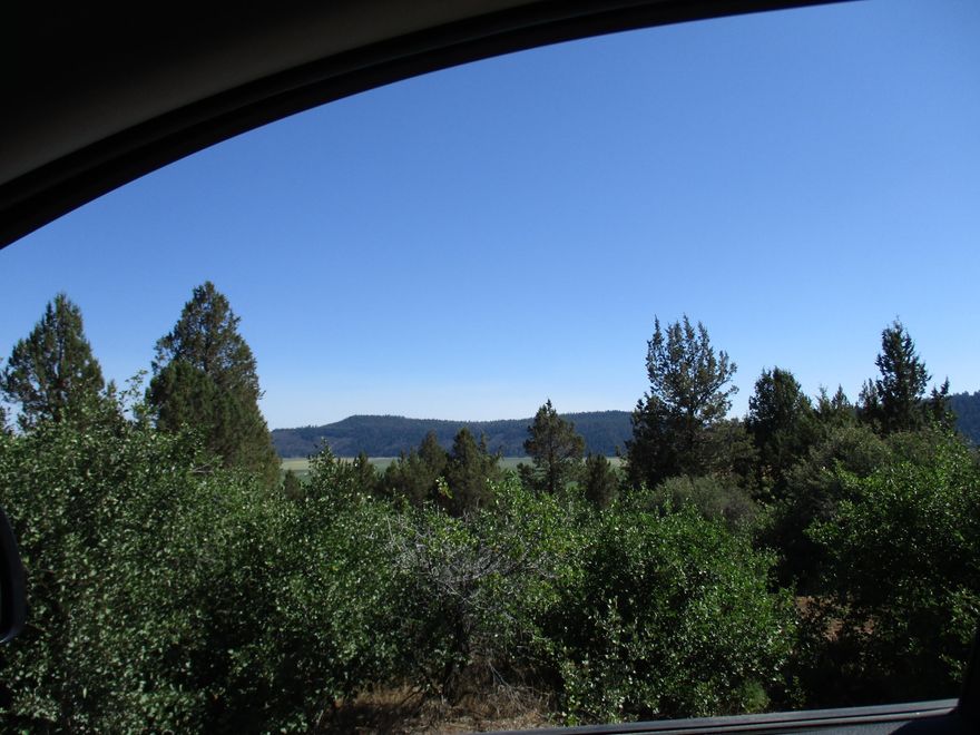 Almost 1 acre in Running Y  located on Crossbill where there are new houses being built. Great View with some Level land ,  The Running Y has public sewer ,Private water and power available  Great buy at $29,000