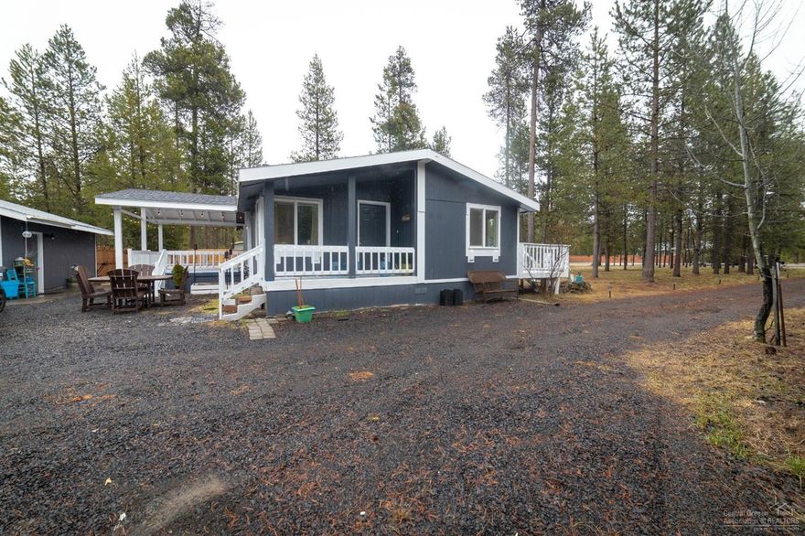 RARE OPPORTUNITY! A cozy, private, fully remodeled manufactured home with a shop sitting on .48 acres!The home is 1100 sq. ft. with 2 bedrooms, 2 full baths, new flooring, cabinetry, appliances, solid surface countertops, lighting, plumbing, paint, and more. The exterior of the home includes a detached 2-car garage/shop with epoxy flooring, storage shed, dog run, covered equipment storage, and a firepit. The home is surrounded by pine trees in the desirable Three Rivers South. This is a must-see! Please note the showing instructions. Due to the COVID-19, I have set up a sanitizing station outside the home for the safety of the homeowners and all touring parties.