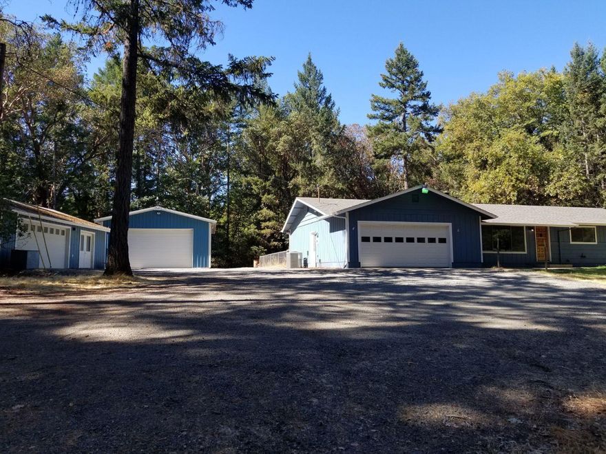 Beautiful 2.5 Acre country property! 3 bed/2 Bath home. New Roof within the last year, new dishwasher, new toilets , sinks , lights fixtures in bathrooms. Painted in August 2018. Attached 2 car garage with custom wheel chair ramp. Detached 2 car garage and a 768 sq ft shop! This home is freshly painted through out the entire inside and move in ready!