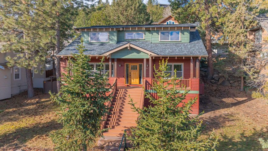 New roof (2025), open-concept Craftsman-style home in Awbrey Village, NW Bend. Inspired by 1910-1940s Old Bend architecture, this home features a grand entrance with an oversized porch w/ under porch storage, Smith Rock, mountain, and sunrise views. The main-level primary suite offers an updated en-suite w/ granite double vanity, oversized tiled walk-in shower w/ bench, and walk-in closet w/Elfa shelving. Hardwood floors extend through the living, dining, and kitchen areas, which include a quartzite-topped island, corner pantry, and stainless steel appliances (new double oven range w/ air fryer). Living room features high ceilings, large windows, gas fireplace, built-in shelving, and bottom-up top-down blinds. Upstairs: great room w/ storage, 2 bedrooms w/ mini-splits, and updated full bath with skylights. Fenced backyard w/ large new covered/uncovered deck, reinforced space for hot tub, garden beds, treehouse, and alley access. Two car garage with Elfa shelving! So many updates!