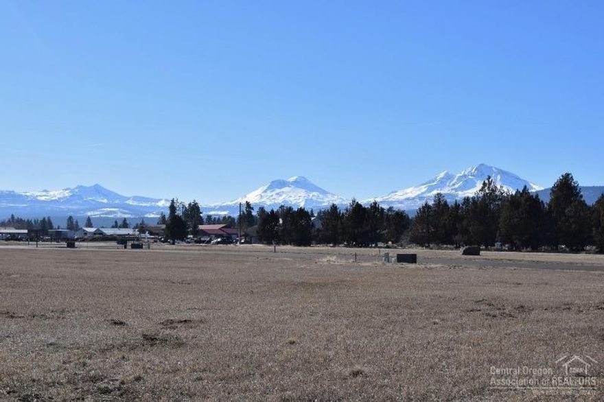 Mixed use light industrial/manufacturing/live work. Close to new post office, walk to town, part of mixed use master plan. This is one of the largest lots in the development and has additional access from a paved alley on the North side of the lot.