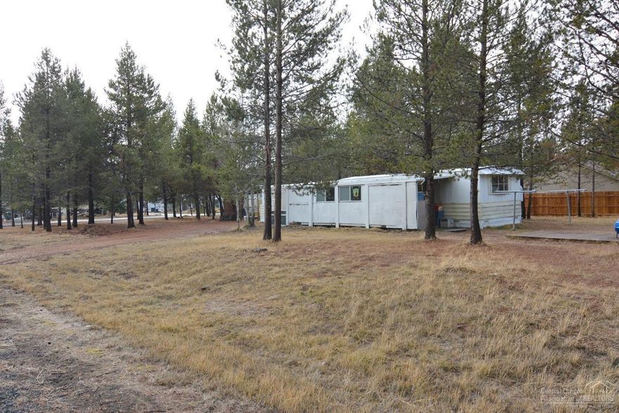 Looking for an investment property or a .52 of an acre lot in OWW2. Sewer water electrical all connected to this 1976 manufatured home. Corner lot, covered parking. Located just minutes to Sunriver, Mt. Bachelor and the High Cascade Lakes. Come take a look at this property.