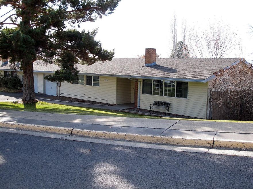 This 3 bedroom home with almost 1350 sq ft with many updates including newer appliances, laminate floors, remodeled bathroom with tile floors, and fresh paint inside. The front yard is nicely landscaped with inground sprinklers. The large back yard is fully fenced with covered RV parking and power , 16 X 12 Storage shed with power and alley access. This home is located in a gated community with a community center and community park and hosts community evens. This home should qualify for 100% USDA financing and is ready to go now so don't wait.