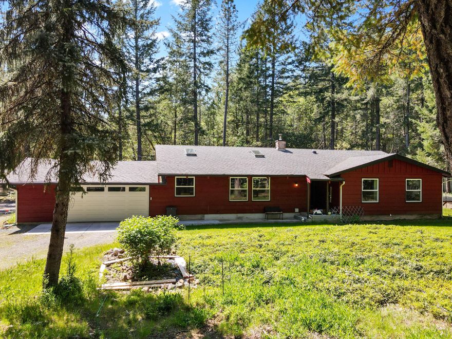 Beautiful home and property on the Illinois River. 9.27 acres of flat land for horses, or other animals, sunny pasture, plus mature trees. Home has so many features and upgrades; large kitchen with granite, new gas range/oven, dishwasher, wood flooring throughout, family/living rooms, big rock fireplace, vaulted ceiling, sauna in primary bedroom, newer mini split system, home has a Generac generator for backup power, bathroom/kitchen have heated floors, so much more! Home has lots of windows for light. 30x50 Metal shop with 220, roll up door, room for lift and compressor. Many outbuildings with power. New electrical in garage. Your own path down to the river. This is a beautiful place to call home!