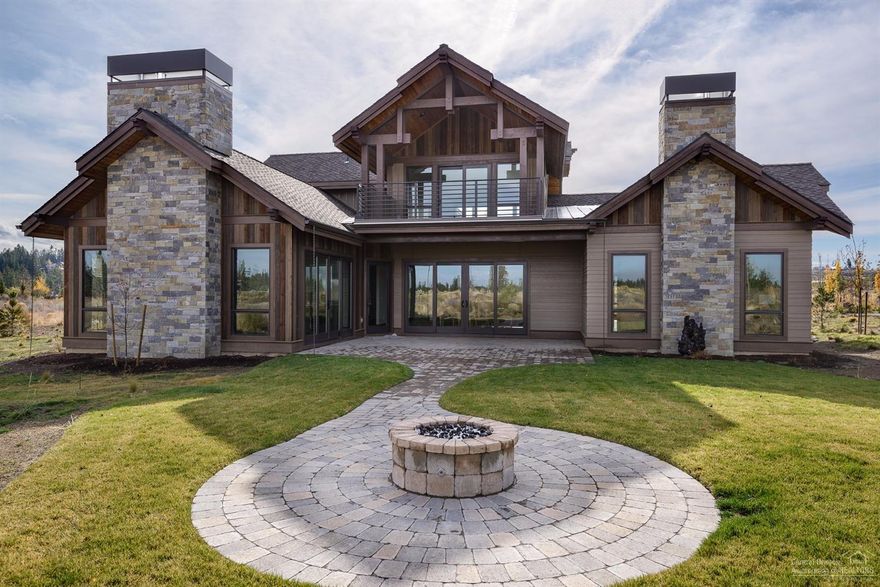 Gorgeous custom home in the highly sought after community of Tetherow with golf & social options. Enjoy Cascade Mountain views from the welcoming great room with rock FP. Sleek chef's kitchen with premier appliances, double ovens, beautiful cabinetry, island, & slab quartz countertops. Private master suite with floor to ceiling FP, soaking tub and dream closet. 2nd master and den on main floor plus showcase wine room. Large bonus with private balcony and 2 bedrooms upstairs. Dream big: dream Tetherow.