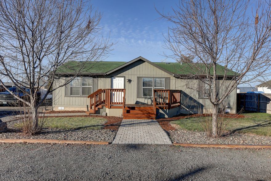 This well kept Manufactured home shows the love and pride that was put into it. From the freshly painted decks to the beautiful hand painted cherry blossom tree on the Livingroom wall. It is located in a tight-knit neighborhood in Culver where the neighbors all look out for each other and are available to lend a hand.