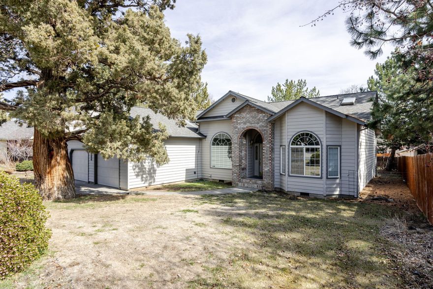 Discover this beautiful 3-bedroom, 2-bathroom home with 1,892 square feet of living space, nestled in a quiet cul-de-sac, of a great neighborhood w a central Bend location. The Primary bedroom w an en suite bathroom featuring a double vanity, jacuzzi tub, walk-in closet, & separate stall shower. The spacious living room is designed for comfort & entertainment, w a gas fireplace, wet bar, & wired for sound. Abundant windows flood the home w natural light. Step outside onto a large entertainment deck, perfect for hosting gatherings or relaxing in the fresh air. The large kitchen boasts abundant storage, a breakfast bar, & a cozy breakfast nook. The second bedroom has a built-in bookshelf, while the third bedroom has a charming bay window. Built-ins & vaulted ceilings throughout the home add a touch of elegance while the mudroom/laundry has a sink and additional storage for convenience. The large double car garage is equipped w shelves & a workbench, ideal for projects and extra storage.