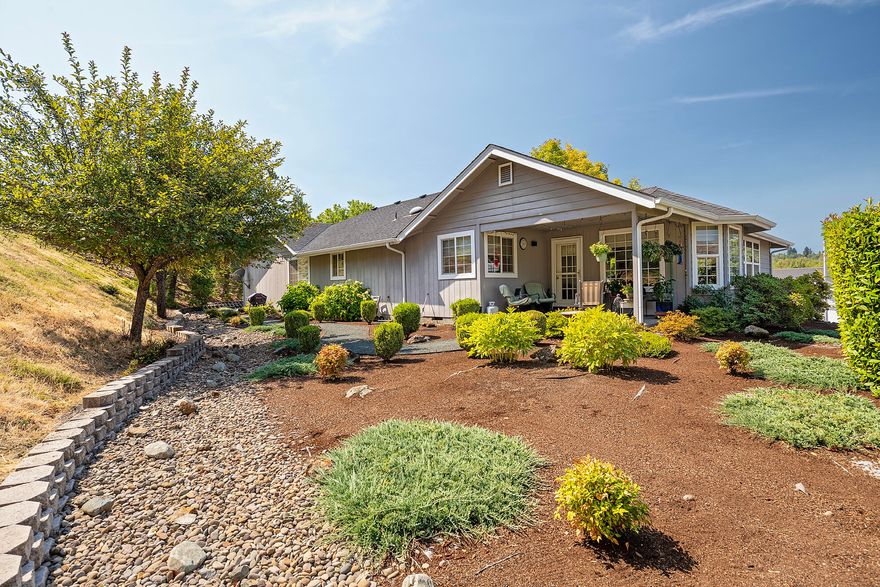 This well-maintained and inviting 3 bed 2 bath home offers 1,765 sq.ft. of comfortable living. Enjoy hardwood floors in the kitchen and dining area, abundant natural light, sweeping mountain views, and vaulted ceilings adding a spacious feel. The private primary suite features a walk-in shower, double vanity and large walk-in closet. Complimented by two additional bedrooms, oversized laundry, and two car garage. Set on a .29 acre landscaped lot that's both beautiful and easy to maintain with sprinkler system. This home provides room to relax in a quiet neighborhood just minutes to town. Seller is offering a 1 yr. home warranty for added peace of mind.